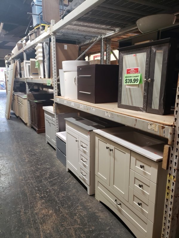 Kitchen cabinets, vanities and a medicine cabinet on the shelves