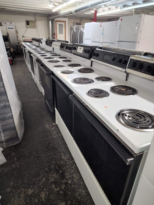 A long line of electric ranges and stoves in stock