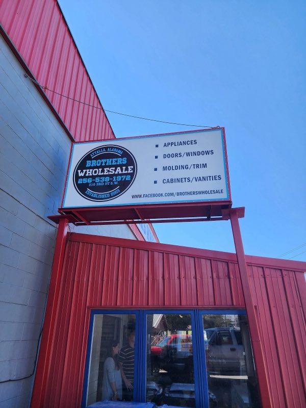 Brothers Wholesale sign listing appliances, doors, windows, molding and cabinets