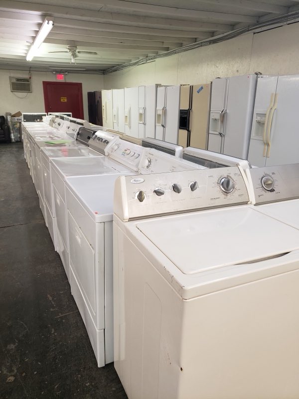 Rows of washers and dryers in the Brothers Wholesale showroom